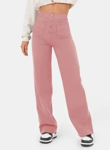 Detailed view of women's high-waisted pink straight-leg pants with button design