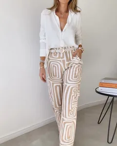 Detail view of casual long sleeve lapel shirt and geometric print wide leg trousers outfit.