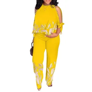 Completo 2 pezzi giallo da donna con top con perline a spalle scoperte e pantaloni
