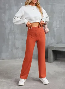 Detailed view of women's high-waisted orange straight-leg trousers with front buttons.