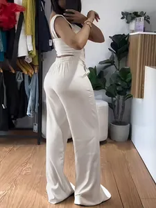 Elegant cream two-piece set featuring a cropped tank top and wide-leg trousers