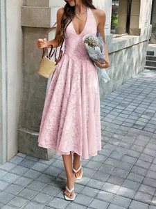 Elegant pink halter neck pleated maxi dress with deep V-neck and jacquard fabric texture detail.
