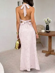 Elegant backless light pink halter top and maxi skirt two-piece set with subtle floral pattern
