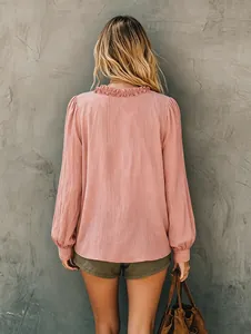 Back view of a pink V-neck casual loose long-sleeve shirt with ruffled collar detail.
