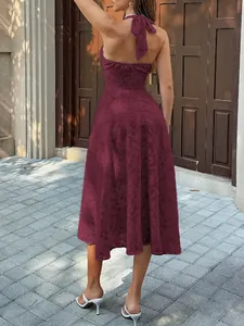 Back view of elegant burgundy halter neck midi dress with exquisite jacquard texture
