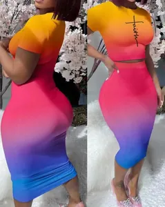 Close-up of women's vibrant sunset gradient crop top and bodycon skirt set with faith print