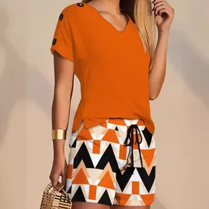 Stylish women's summer two-piece outfit featuring an orange V-neck top and patterned shorts
