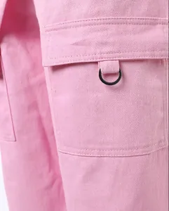 Detailed macro view showing the pink fabric texture and metal ring on cargo pocket