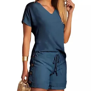 Casual two-piece summer set featuring V-neck top and decorative button shorts in teal blue