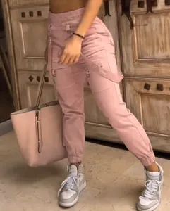 Pink cargo pants for women with multi-pocket design and elastic waist for retro style.