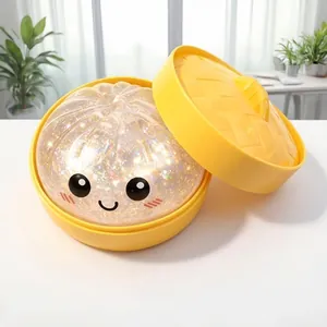 Close-up of glitter-filled steamed bun squishy toy in a yellow steamer basket