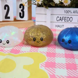Detailed view of three cute glittery steamed bun squishy toys for stress relief
