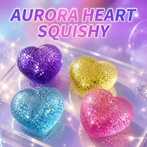 Macro view of four colorful sparkling heart-shaped squishy toys on a clear tray