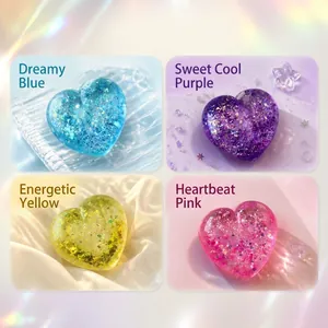 Detailed view of heart-shaped glitter squishy stress relief toys in four vibrant colors