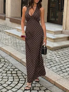 Elegant brown halter neck polka dot maxi dress featuring a deep V-neck for summer