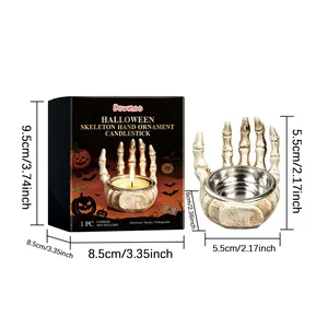 Halloween skeleton hand candlestick ornament with dimensions and packaging box.