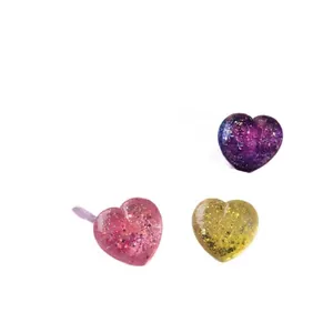 Set of three glitter heart squishy toys for stress relief, soft slow rising texture.