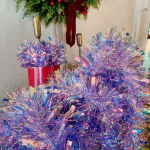 Macro detail of shimmering iridescent purple and blue tinsel garland for holiday decor