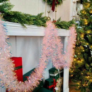 Iridescent pink tinsel garland for festive Christmas fireplace mantel decoration
