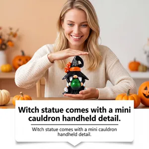 Detailed view of resin witch gnome statue holding a green mini cauldron for Halloween decor.