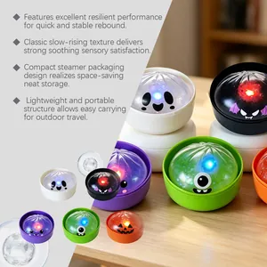Detail view of colorful Halloween dumpling squeeze toys with built-in LED glowing lights