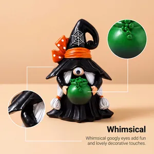 Detail view showing whimsical googly eye and textured green bubbles on Halloween gnome