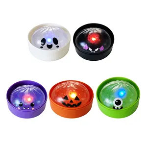 Set of 5 LED light-up Halloween bun squeeze toys in vibrant colors on white background.