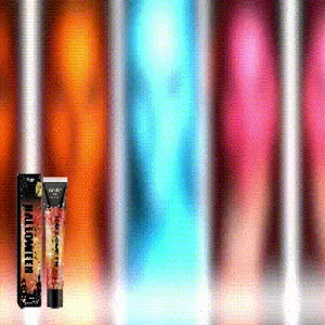 Gros plan sur le gel pailleté orange d'Halloween en tube et son emballage festif coloré