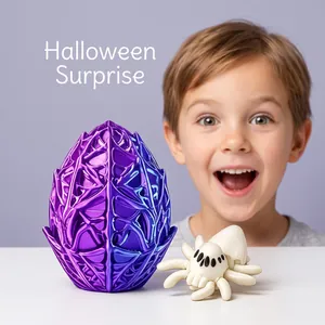 Close-up of a 3D printed purple spider egg and white toy spider for Halloween decor