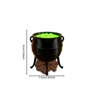 Detailed view of a Halloween witch cauldron ornament with 9cm height dimension mark.