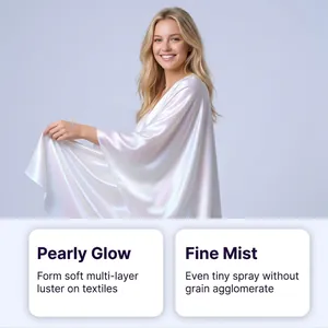 Detailed view of the pearly glow effect on white fabric created by the textile luster spray