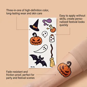 Detailed view of Halloween pumpkin and ghost temporary tattoo stickers applied on arm