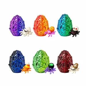 Collection of colorful 3D-printed Halloween spider eggs with decorative miniature spiders