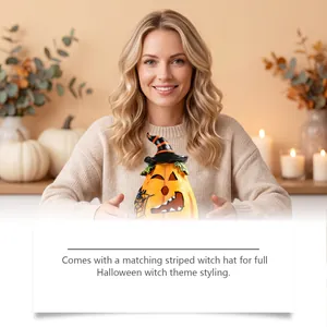 Detailed view of resin Halloween pumpkin decoration with a matching striped witch hat.