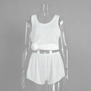 Casual white semi-transparent tank top and shorts set for beachwear and leisure