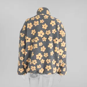 Back view of a cozy grey fleece sweatshirt with yellow flower patterns for women.