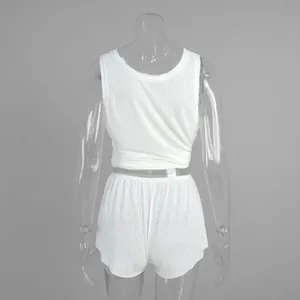 Detailed back view of semi-transparent white beach set with tied vest and loose shorts