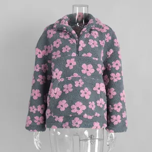 Grey polar fleece hoodie with pink flower pattern and half-zip detail.