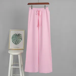 Elegant soft pink knitted wide-leg trousers featuring an adjustable drawstring waist.