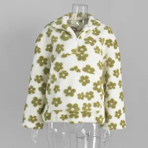 Front view of a cozy white sherpa sweatshirt with green floral patterns on a mannequin.