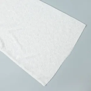 Macro close-up detail of white semi-transparent knit fabric texture for beachwear set