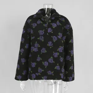 Women's black sherpa fleece sweatshirt with purple floral print and quarter-zip collar