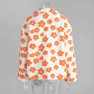 Back view detail of a cozy white plush fleece hoodie featuring orange flower patterns