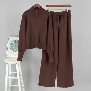 Detailed view of the dark brown two-piece knit set featuring a zip-up sweater and pants.
