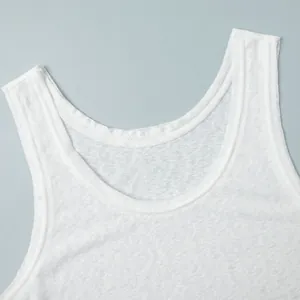 Close-up of white semi-transparent tank top showing neckline and breathable fabric texture