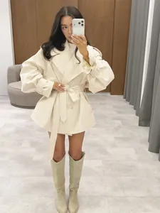 Elegant cream-colored double-breasted mid-length trench coat featuring a waist belt