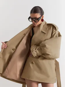 Modern khaki double-breasted oversized trench coat featuring stylish puff sleeves and belt