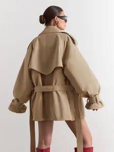 Back view of a stylish khaki trench coat with adjustable waist belt and cuff straps.