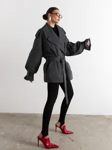 Stylish dark grey double-breasted trench coat with a waist belt and wide lapels