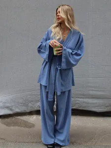 Stylish blue cotton two-piece loungewear set with wide-leg pants and tie-waist top detail